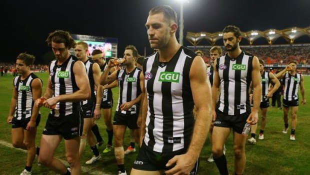 Collingwood trudges off after losing to Gold Coast.