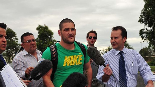 Brendan Fevola arrives at Casey Scorpions football training tonight for the first time.