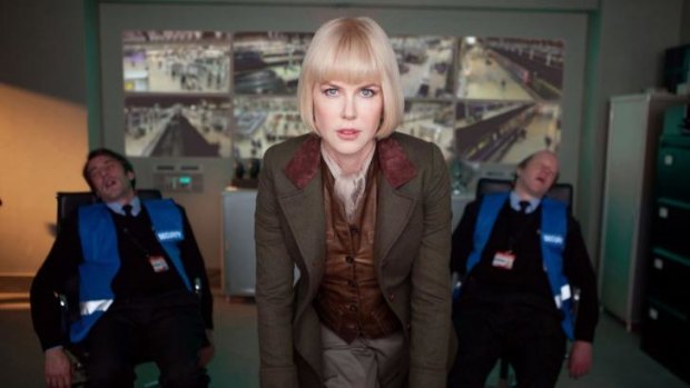 Nicole Kidman as evil museum taxidermist Millicent in <i>Paddington</i>, after knocking out two Tube security guards in the control room.