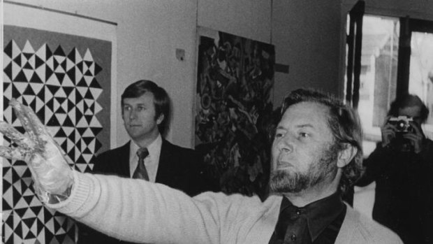Dr Donald Brook, Senior Lecturer in Fine Art at Sydney University and art critic for the Sydney Morning Herald, throws paint at a painting by Sydney artist, Mike Brown, 27 July 1972.