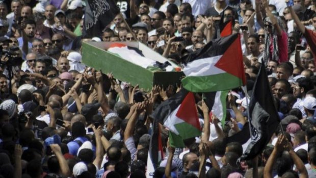 Palestinians carry the body of  Mohammed Abu Khdeir in Jerusalem.