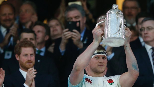 Leader: England's Dylan Hartley holds up the Calcutta Cup.