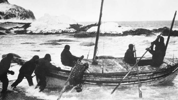 Frank Hurley's photograph of Shackleton's rowing boat, the James Caird, being launched from Elephant Island in 1916.
