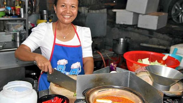 Preparing fish head soup at Petaling Jaya food area.