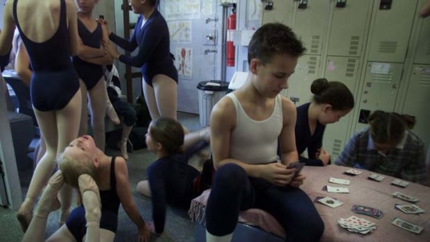 Campbell as a teenager playing cards between ballet classes at Randwick's Academy Ballet.