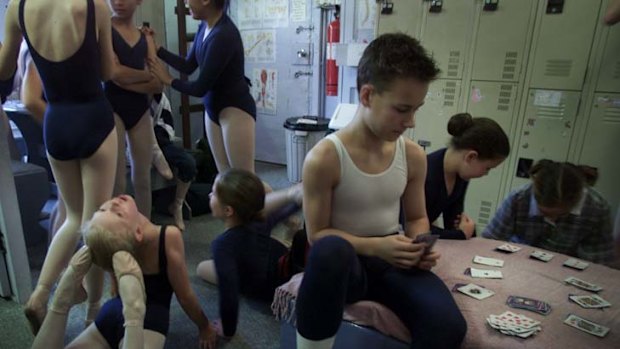 Campbell as a teenager playing cards between ballet classes at Randwick's Academy Ballet.