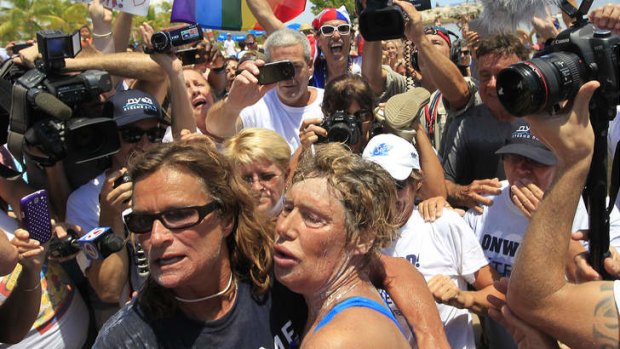 US long-distance swimmer Diana Nyad, 64, is welcomed ashore after completing her swim from Cuba to Key West, Florida.