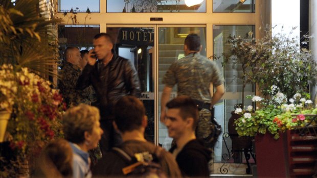 Isolated: Police guard the entrance of a quarantined hotel in Skopje, where the British man had stayed.
