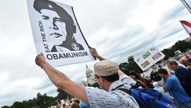 Protesters descended on Washington, some carrying placards lampooning President Barack Obama as a Che Guevara determined to take the US down a socialist path.