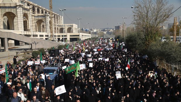 Iranian protesters chant slogans at a rally in Tehran last week.