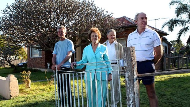 In the path of the F6 ... Glen Sinclair, far right, with his family outside their house in Ramsgate in Sydney's south.