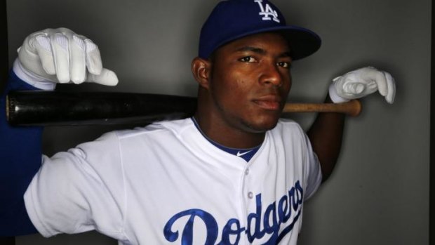 Yasiel Puig fled Cuba on a boat run by smugglers who allegedly made death threats against him and a boxer, according to court documents.