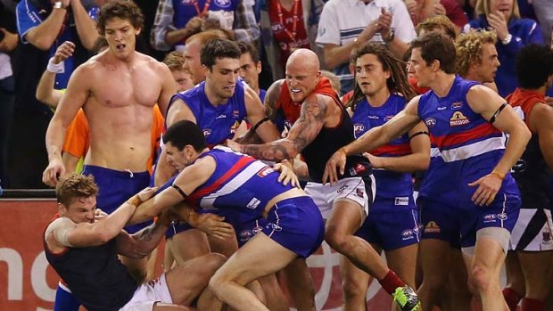 Shirtless: Will Minson looks on during the half-time melee.