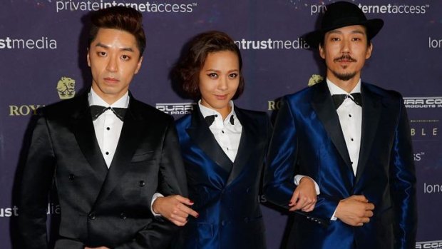K-Pop stars Yoon Mi-rae (centre) and her husband Tiger JK (right) are unhappy over an alleged breach of copyright.