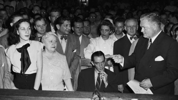 Eddie Waitkus sits in a wheelchair in court.