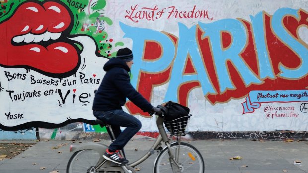 French street artists have been taking to city walls and billboards in Paris to paint notes of defiance.