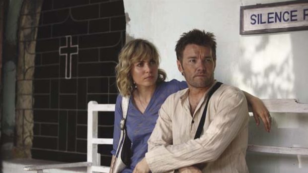 Baptism of fire ... Ben (Joel Edgerton) and Fiona (Radha Mitchell) in a scene from The Waiting City.