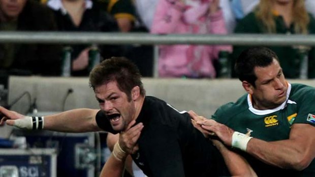 Richie McCaw, the All Blacks captain, celebrates after scoring a try they gave his side a sniff of victory.