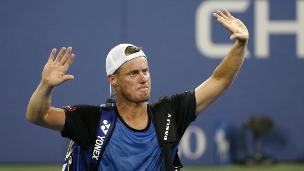 That's all folks: Lleyton Hewitt bids farewell to the crowd after losing to countryman Bernard Tomic at the US Open.