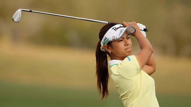 Japan's Ai Miyazato makes her second shot on the 16th hole during the third round of the LPGA Founders Cup.
