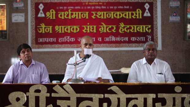 A Jain monk Ravindra Muniji, centre, speaks to the media in connection with a teenage girl who died after fasting for 68 days in a religious Jain ritual in Hyderabad, India.