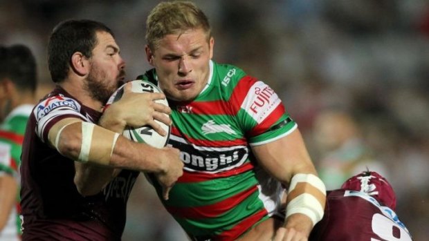Hard yards: George Burgess takes on the Manly defence.