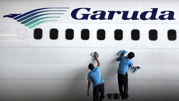 Spruced up ... a Garuda plane undergoes maintenance at Soekarno-Hatta International Airport.