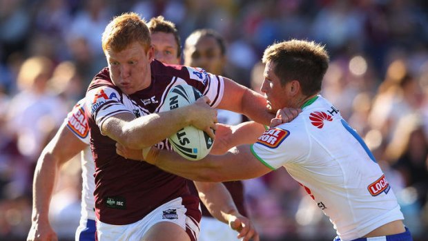 Daniel Harrison of the Sea Eagles is tackled during the round nine NRL match between the Manly Sea Eagles and the Canberra Raiders at Brookvale Oval.