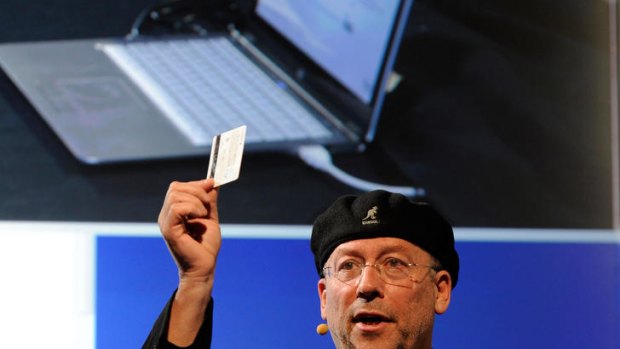 Shmuel "Mooly" Eden demonstrates an Ultrabook with technology that recognises the user's credit card that can be tapped on the keyboard to make purchases.
