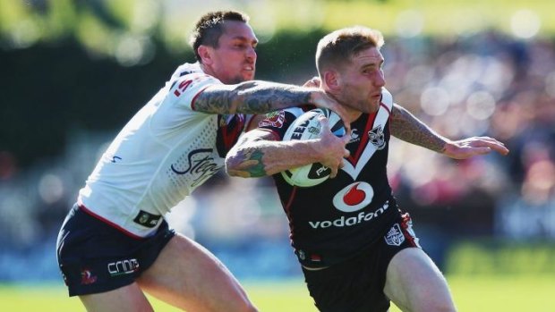 No contest: Warriors player Sam Tomkins makes a break against the Roosters.