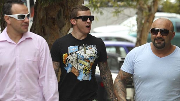 Man inthe middle . . . Todd Carney in Bondi yesterday. The Roosters indefinitely suspended their five-eighth after it emerged he had been involved in more laste-night drinking.