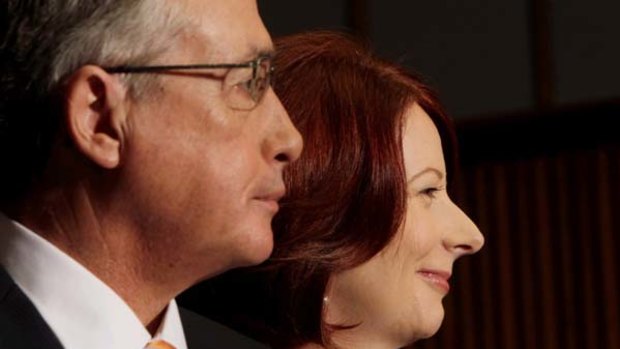 Julia Gillard and her deputy, Wayne Swan, announce details of the mining tax agreement yesterday.