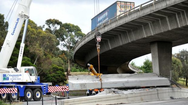 A semi-trailer hauling a 60-tonne concrete girder lost its load, damaging a pylon at the Ferntree Gully Road on-ramp.