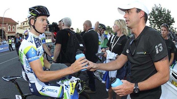 Simon Clarke ... takes bidon from Orica Green Edge Team staff after Peoples Choice Criterium.
