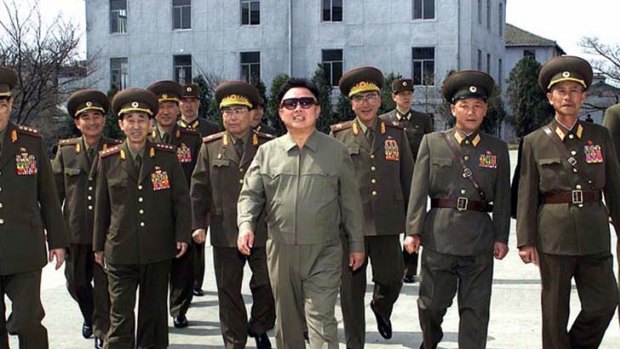 Dear Leader ... Kim Jong-il walks with military commanders.