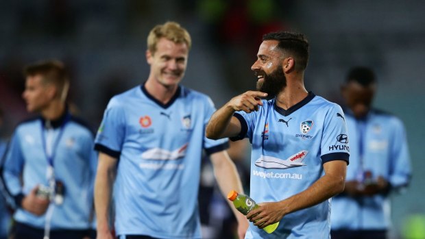 All smiles: Matt Simon, left, and Alex Brosque laugh after the game.
