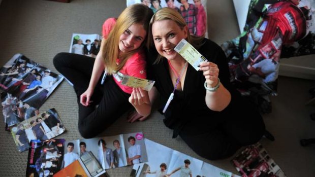 Christine and Charlotte Henderson with their One Direction tickets.