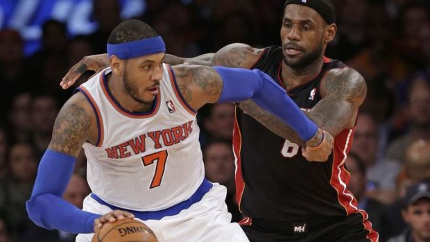 New York Knicks forward Carmelo Anthony is defended by Miami Heat's LeBron James.