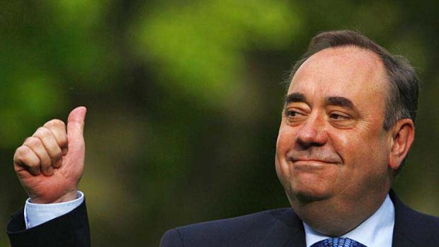 Scottish National Party leader Alex Salmond gestures to supporters in Edinburgh.