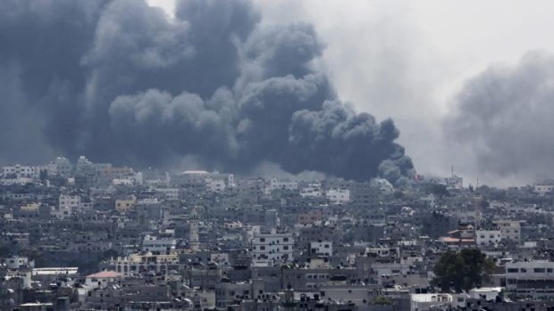 Smoke rises after an Israeli missile hit Shijaiyah neighbourhood in Gaza City, northern Gaza Strip, as fighting claims more than 500, mostly Palestinian, lives.