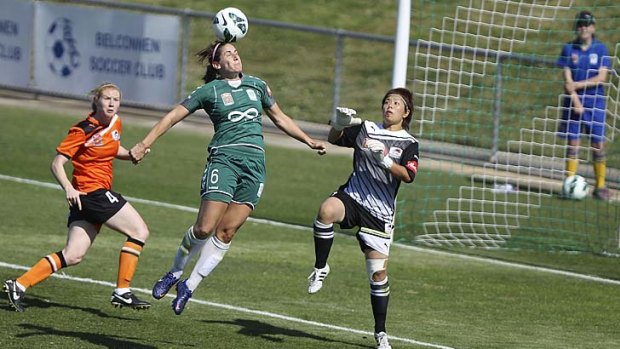 Caitlin Munoz of Canberra United leaps in a bid to head the ball home.