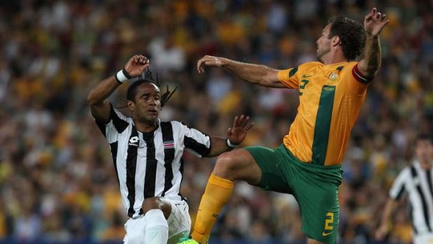 Socceroos captain Lucas Neill rises to the challenge.
