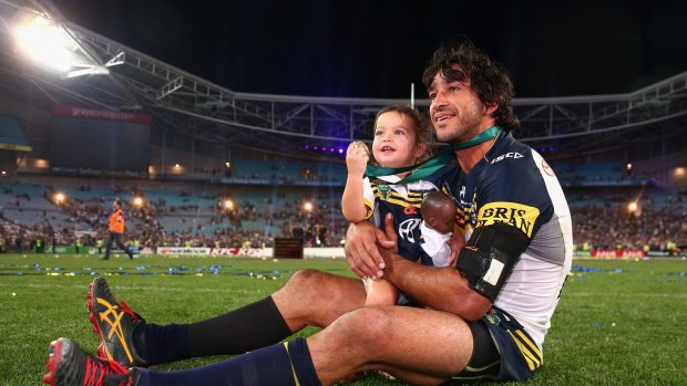 The moment: Johnathan Thurston with daughter Frankie after winning the 2015 NRL Grand Final.