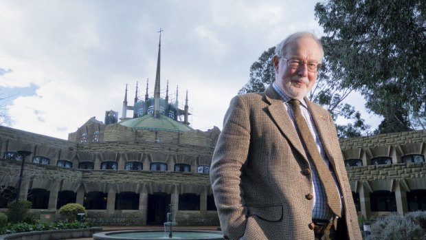 Conductor Richard Divall outside  Melbourne University's Newman College dome.