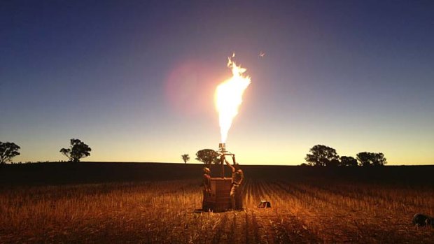 A balloonist fires up his burner at Canowindra.