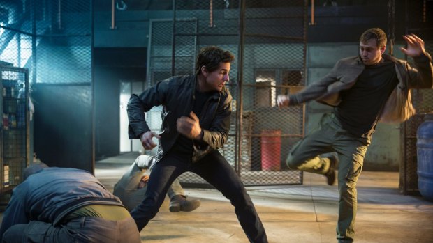 Tom Cruise as Jack Reacher (left) and Gordon Alexander as a cage-match fighter in <i>Jack Reacher: Never Go Back</i>.
