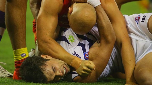 Close encounters: Ryan Crowley keeps close tabs on Gary Ablett.