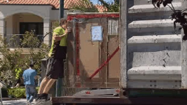 Removalists pack up the Oswals' belongings at their Dalkeith mansion back in January.