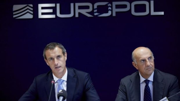 Europol director Rob Wainwright (left) announced at the Hague that police had arrested more than 1000 suspects and rescued at least 30 trafficked children in an unprecedented swoop on organised crime groups across Europe.