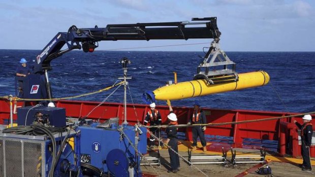 The Bluefin 21, the Artemis autonomous underwater vehicle (AUV), is hoisted back on board the Ocean Shield.